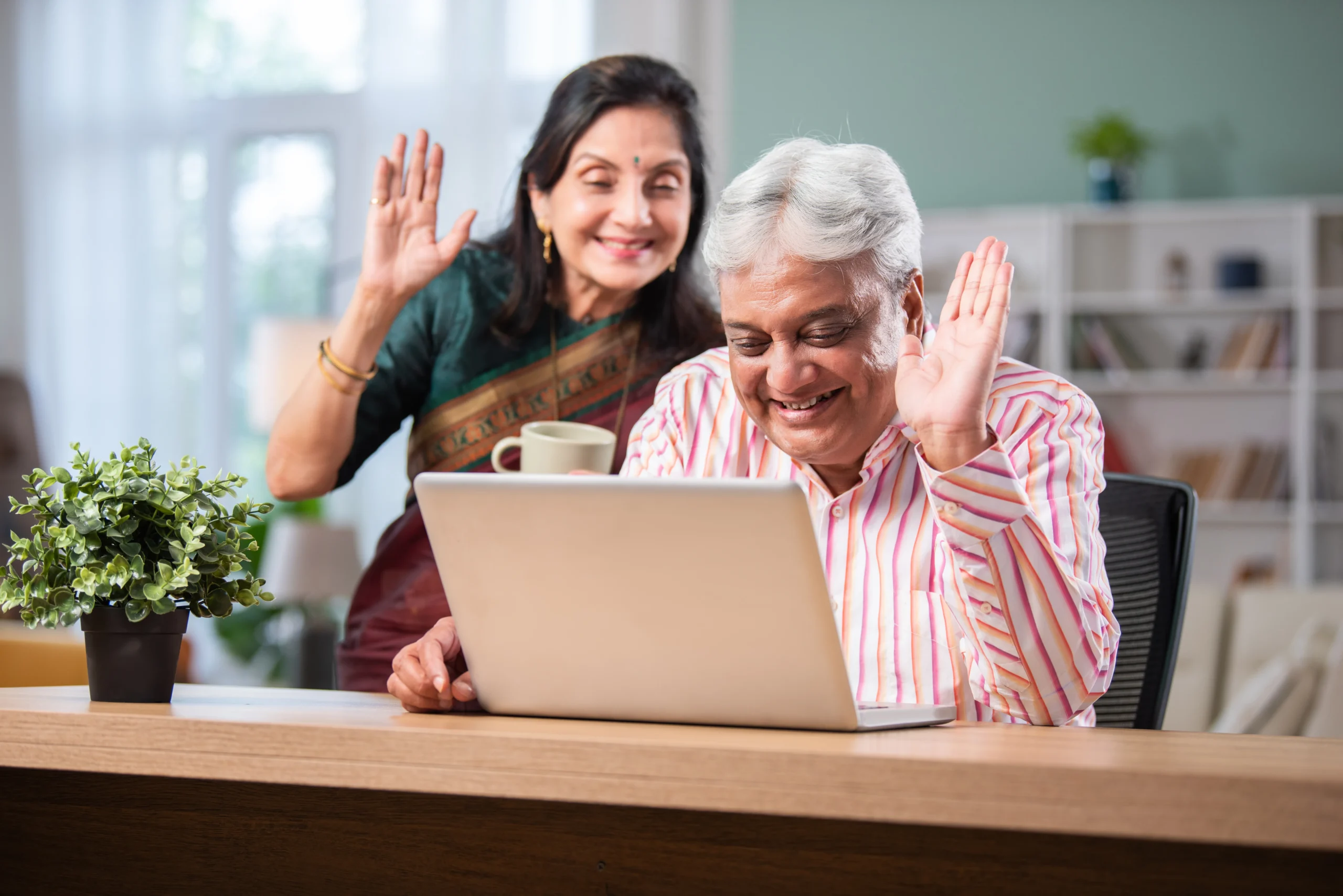 Assisted Living 12 senior indian old couple using laptop sitting at b 2025 01 16 13 04 42 utc scaled